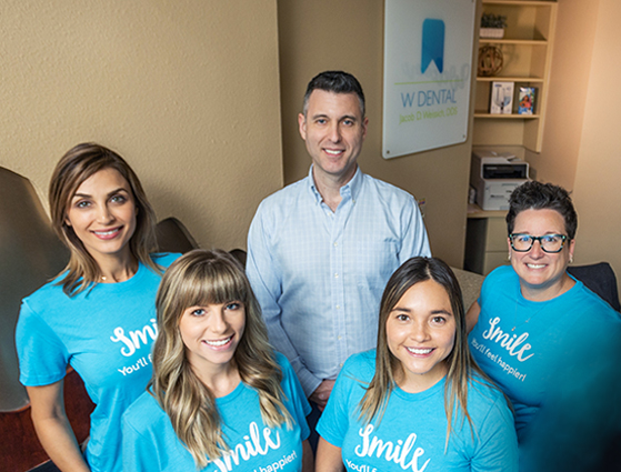 Two Fresno dental team members talking to a patient