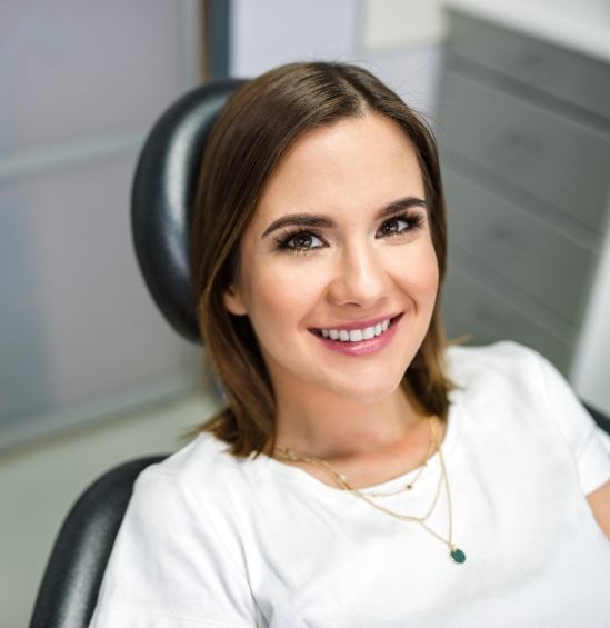 Young woman smiling in dental chair