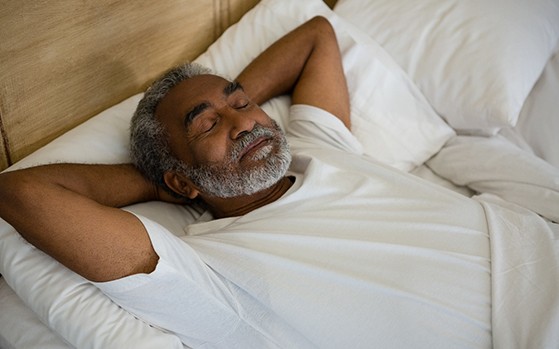 Man sleeping on his back