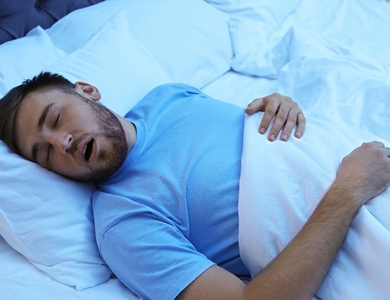 Man sleeping in a bed