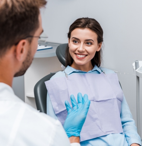 Smiling woman listening to her dentist