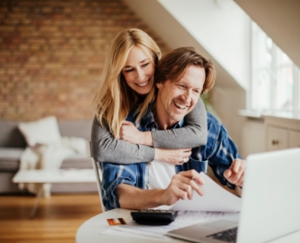 Man and woman looking at laptop