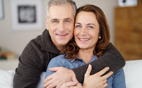 Man and woman smiling after preventive dentistry in Fresno