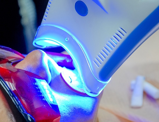 Man receiving teeth whitening in Fresno